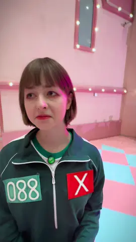 A post by @endomarf on TikTok caption: I’m here by accident #squidgame #squidgameedit #netflix #cosplay #pebble 