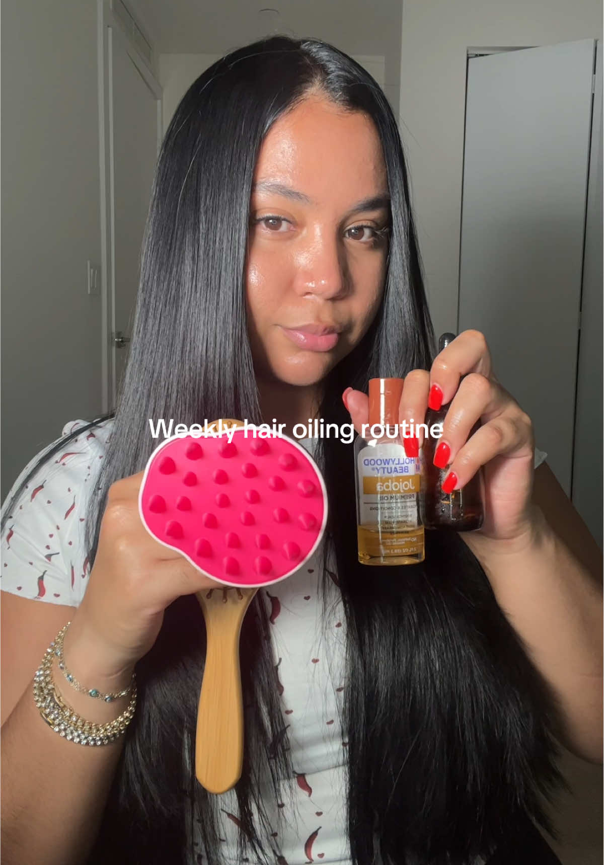 A post by @ on TikTok caption: Hair oiling day = best day of the week 🩷 #hairtok #healthyhair #hairoil #hairoiling #shinyhair #longhair #hairgrowthoil #hairgrowthtips #hairgrowth 