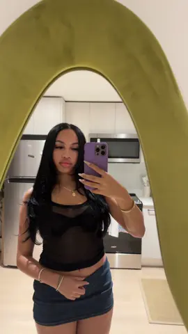 A post by @zizzysizzle on TikTok caption: A tank top and mini skirt is my go to #nightout 