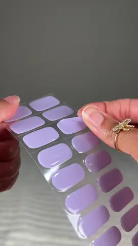 A post by @galorase on TikTok caption: This one is called Lavender Fields 🪻💜💜 FREE NAIL LAMP when you get 2 or more gel strips 💕 Our gel nail strips simplify the process of doing your nails. Just stick them on and cure! 💅 It saves you money and a trip to the salon ⏰ ✨ Easy to apply & remove ✨ Lasts 2-3 weeks ✨ Odorless ✨ Non-damaging ✨ Semi-cured gel nail strips ✨ Affordable Get your own gel strips by going to the lenk in BlOO 🥰 Before they sell out again!  #gelnailsathome #gelnails #summernails #gelnailsticker #usa  #easynails