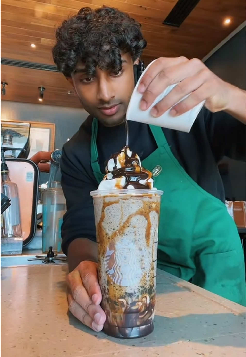 A post by @itsjoboi on TikTok caption: Marble Frappuccino is one of my favorite drinks ever!🔥 #fyp #Viral #trend #starbucks #indian #barista #brown 