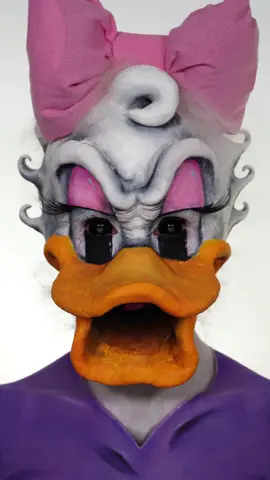 A post by @hollymurraymakeup on TikTok caption: DAISY DUCK inspired makeup! 😱 I’m so sorry! Who wants the removal?! 