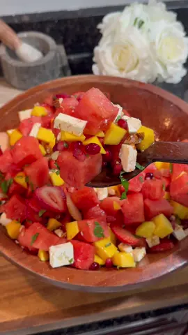 A post by @benjixavier on TikTok caption: THE Summer Salad 🍉🌶️✨ Sweet, juicy, spicy, crunchy, refreshing… all in one bite. This watermelon salad hits every craving, and it’s almost too pretty to eat… Almost. 😋 Here’s what’s in the bowl: 🍉 Watermelon, diced 🥭 Mango, diced 🍓 Strawberries, sliced ❤️ Pomegranate arils 🌰 Almonds, chopped 🌿 Mint leaves, chopped 🧀 Feta cheese, diced (I used cow feta) 🍋 1 lime, juiced 🌶️ A lil chili powder kick Toss it all together and try not to eat the whole bowl yourself. No promises. 🔥