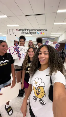 A post by @brownjadaa on TikTok caption: Surprised her? Yes. Embarrassed her? Also yes😭😭😭 @mikayla #fyp #surprise #airport #collegebasketball #team #teamusa #teammate #goldmedal #mvp 