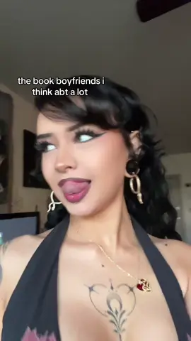 A post by @chiquitaolguita on TikTok caption: *kicks feet* 💅🏻💅🏻💋💋#tattoos #piercings #BookTok #alternative #lightsout #monsterromance #darkromance #fantasyromance 
