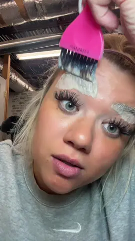 A post by @blondeandabaddie on TikTok caption: tint my brows w me!