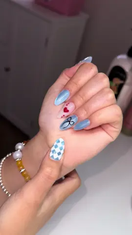 A post by @danyfloresnails on TikTok caption: Alice in wonderland ♥️ #aliceinwonderlandnails #aliceinwonderland #nails #danyfloresnails 