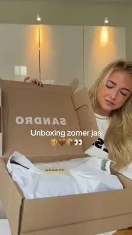 A post by @ninaschotpoort on TikTok caption: Unboxing mijn nieuwe zomer jas van Sandro 🤎 no spon 