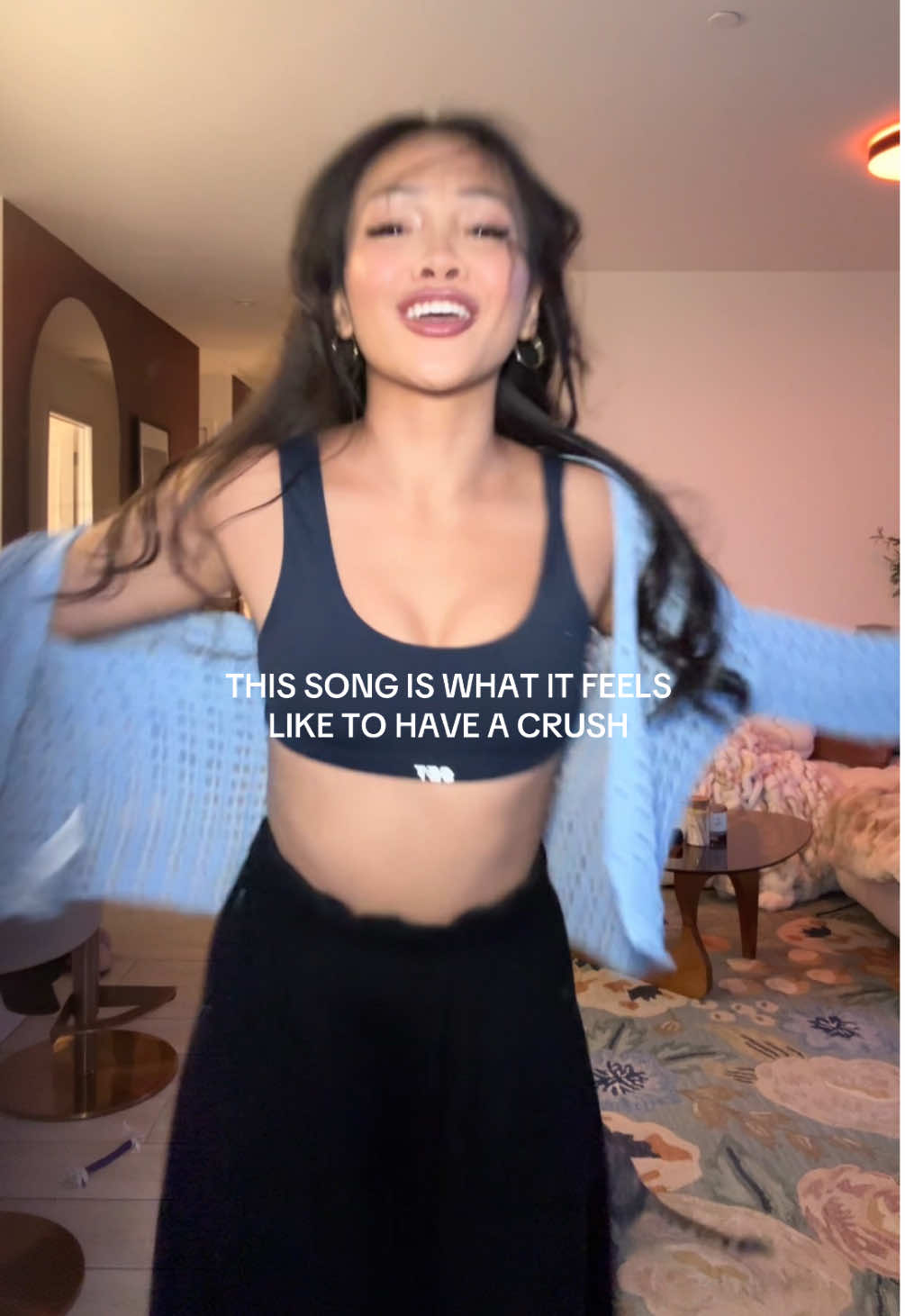 A post by @jenntranx on TikTok caption: Giggling and kicking my feet rn 