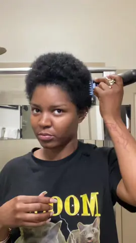 A post by @nymcfly on TikTok caption: And did. I had to double back on the back of neck the next day.  #shorthairstyles #selfhaircut #pixiecut #diyhaircut 