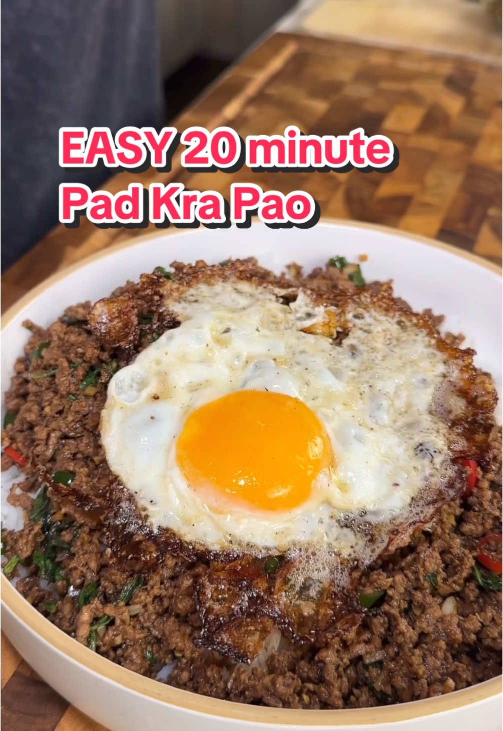 A post by @ice.karimcooks on TikTok caption: Easy 20 minute Pad Kra Pao (recipe👇🏽) @Hay Day is my favortie way to de stress after work or while i wait for my food to cook! check out my farm and play with me the link is in my bio! 🐣🐄🥚 #haydaypartner #hayday  Macros (x4 servings): 406 calories |46g P | 9g C | 19g F Beef : 1 tablespoon avocado oil 1 lb 96% lean ground beef 4-5 large garlic cloves, finely minced 🧄  4-5 fresh red thai chili 🌶️  1.5 teaspoon dark soy sauce  2 tbsp oyster sauce  1 tbsp soy sauce  2 tbsp brown sugar  White pepper, 1/4 tsp Sweet Thai Basil, 1/2 cup Pinch MSG Top with a crispy fried sunny side up egg 🥚  Serve over white rice and enjoy! 😍 . . . . . #icekarim #easyrecipes #mealprep #quickrecipes 
