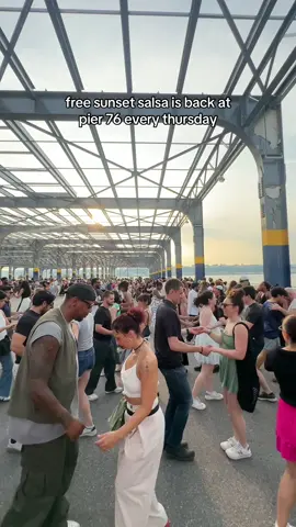 A post by @newyorkbucketlist on TikTok caption: The first Sunset Salsa at Pier 76 of the summer! 💃 FREE and running everything Thursday until August 14th. Join world-renowned instructors for free lessons followed by open dancing sessions.  All levels welcome and no partner needed! 6:30 PM: Beginner Lessons 7:15 PM: Open Dance More details + full summer schedule for everything happening at Hudson River Park can be found at our link in bio 👉 @NYbucketlist #Summer #NYC  