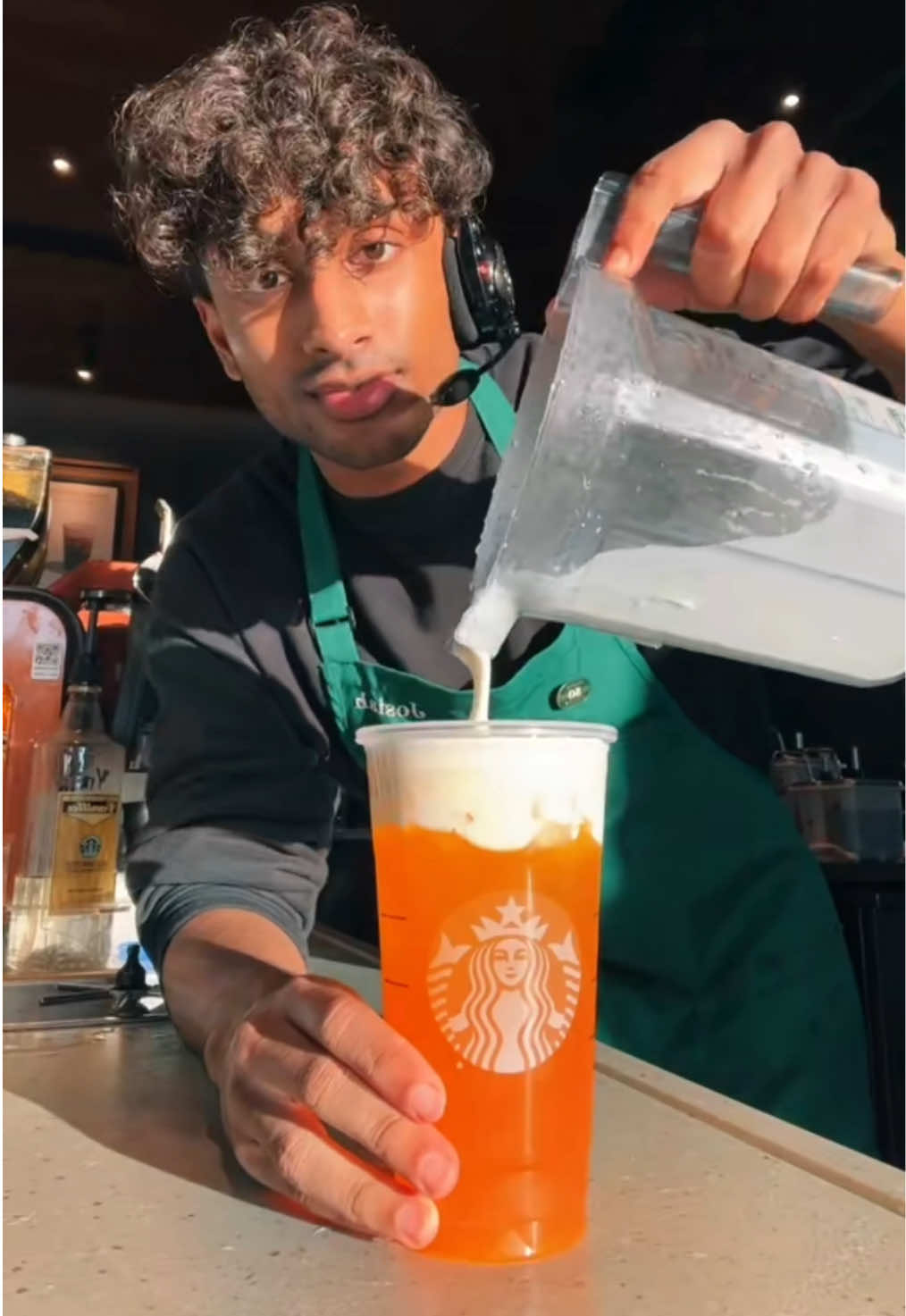 A post by @itsjoboi on TikTok caption: The Naruto Drink gives me the W over Sasuke🔥 #fyp #Viral #trend #starbucks #indian #barista #brown 