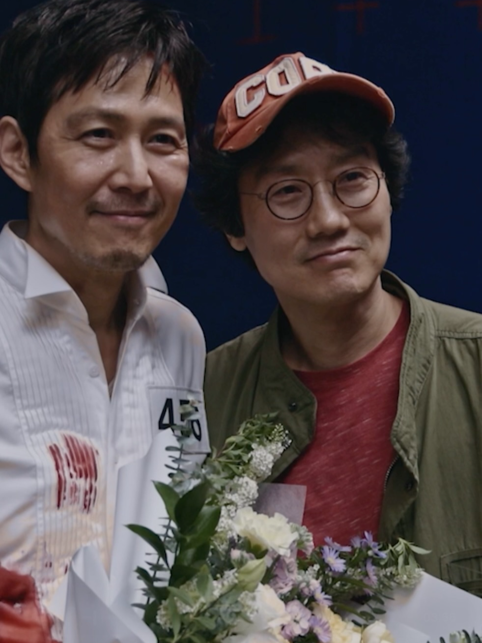 A post by @squidgamenetflix on TikTok caption: The Squid Game cast and crew deserve all their flowers 💐 #SquidGame