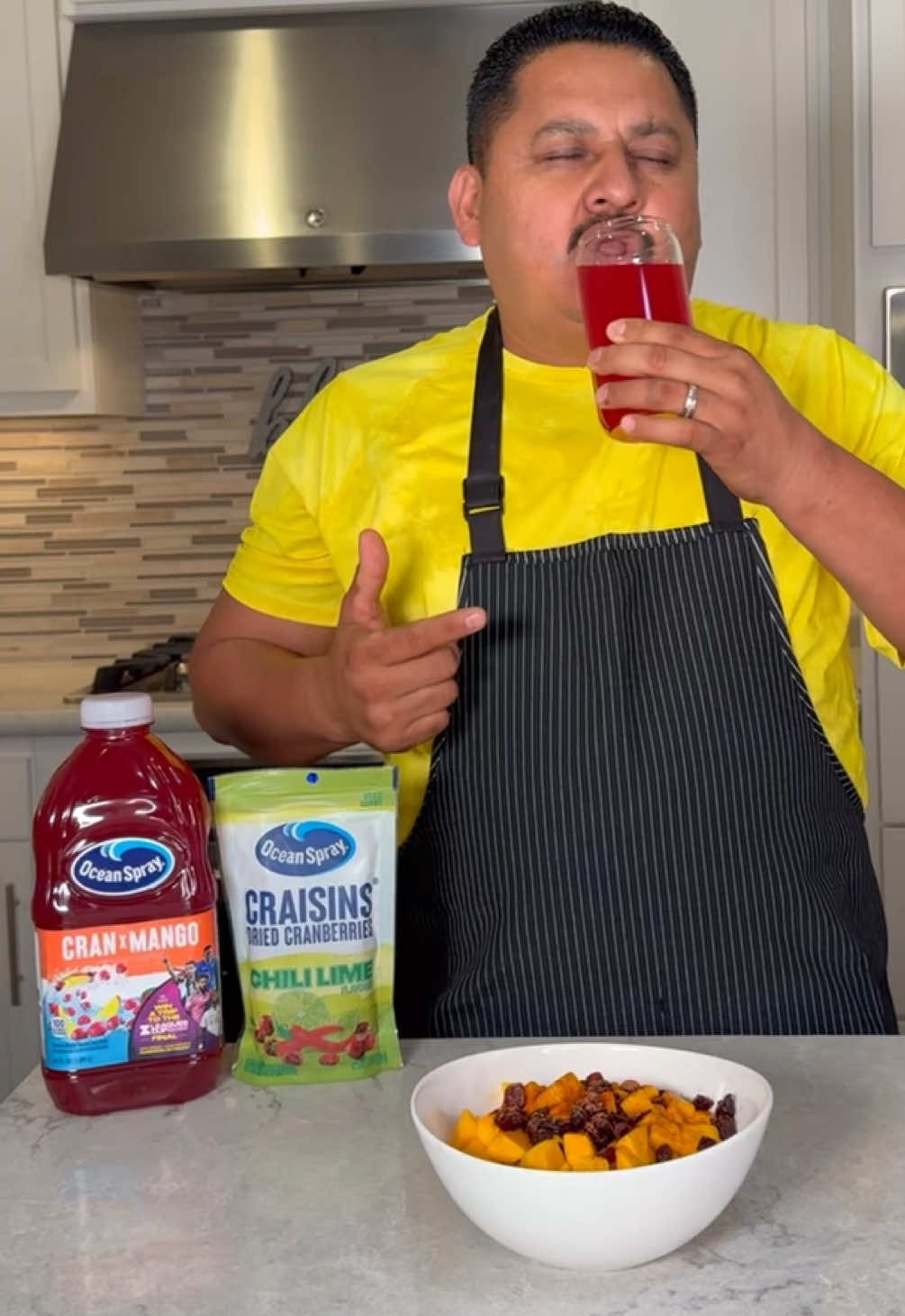 A post by @thesalguerofam on TikTok caption: Tasty snack + refreshing Ocean Spray Cran-Mango drink = GOOLS! @Ocean Spray Inc. #JustAddCran 