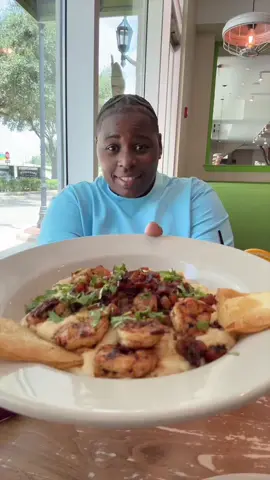 A post by @zinwithin on TikTok caption: This is everything I ate the Toasted Yolk Shrimp Grits and Donuts #mukang #foodies #foodtiktok #foodreview 