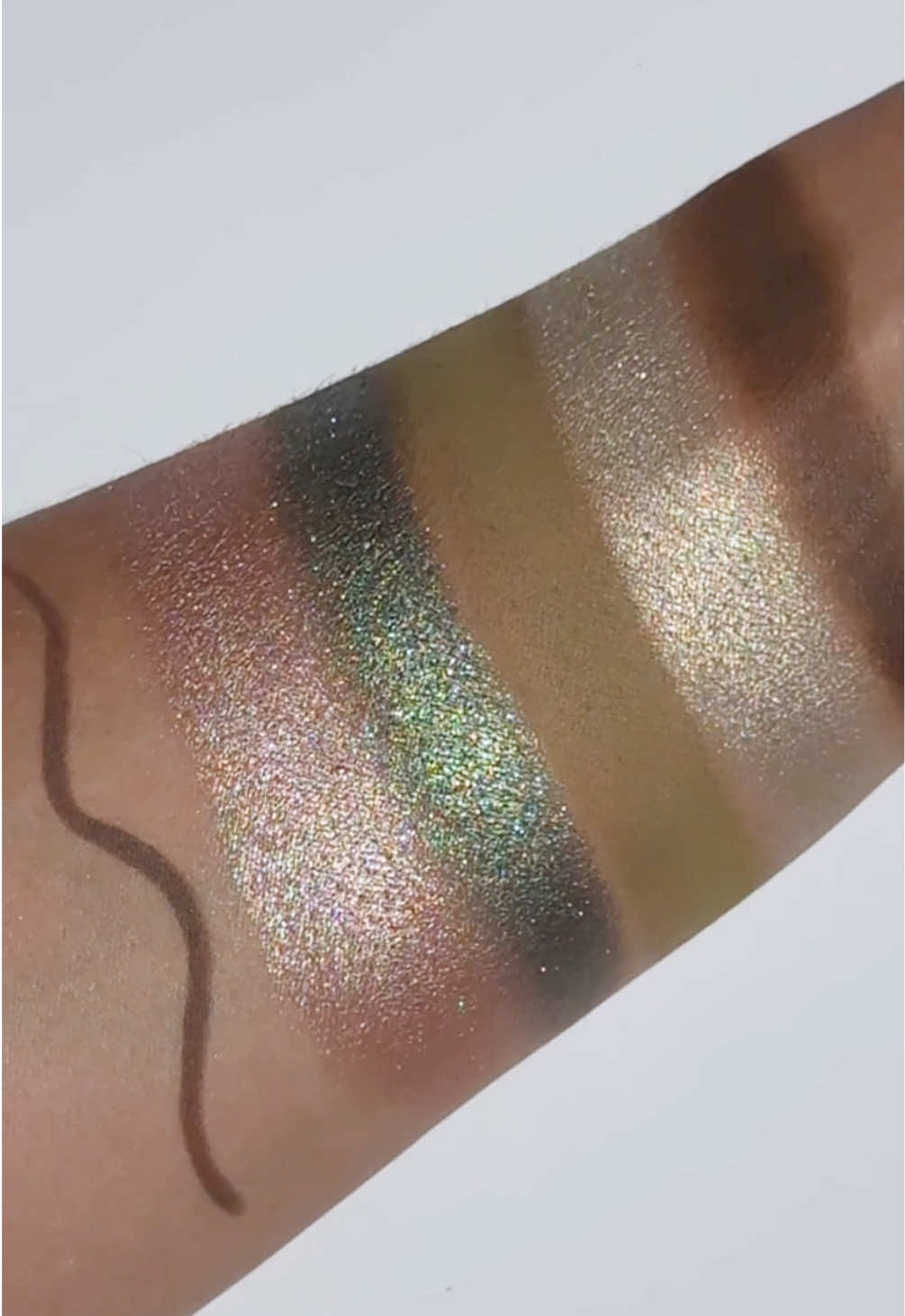 A post by @natashadenona on TikTok caption: OUT NOW!!! My NEW MINI GLOOM EYESHADOW PALETTE + NEW MACRO TECH EYE CRAYON in shade TAUPE ARE AVAILABLE NOW AT www.natashadenona.com !!! Available EXCLUSIVELY in the US @ultabeauty ⭐ ✨Check out my highlights for the launch dates of your favorite ND resellers ✨ #explore #natashadenona #minigloompalette #macrotech   