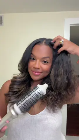 A post by @evelyngonz_ on TikTok caption: I’m gonna call this the GLOWUP brush 🤏🏾😍 #stylux #tymobeauty #blowoutbrush #bouncyhair 