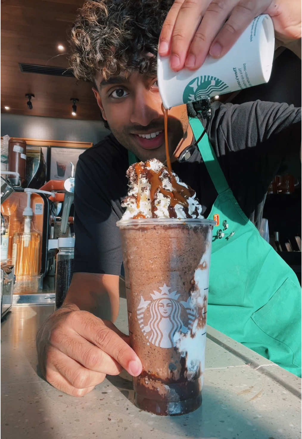 A post by @itsjoboi on TikTok caption: The Brownie Frappuccino is BUSSIN at Starbucks🔥 #fyp #viral #trend #starbucks #indian #barista #brown 