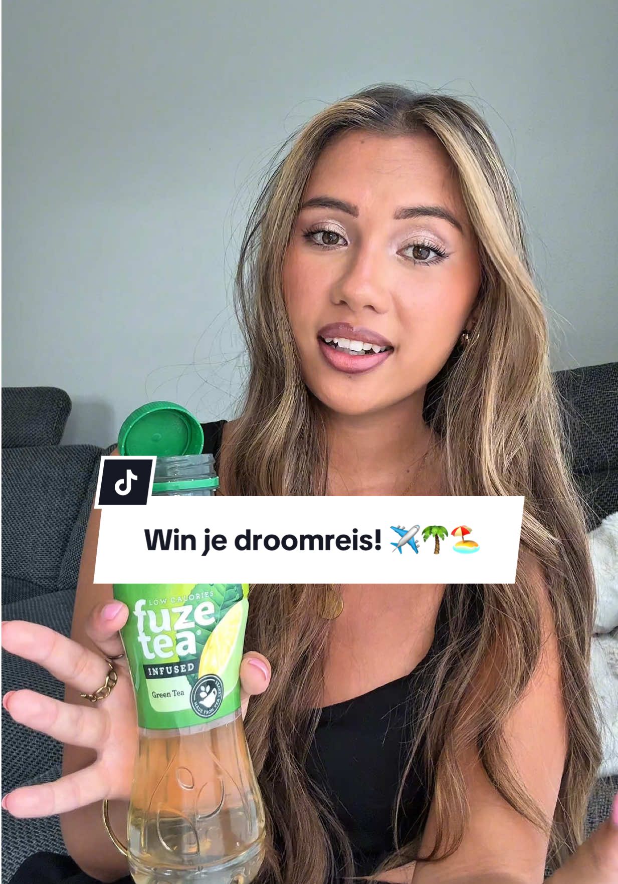 A post by @jahlyssiawithagen on TikTok caption: Win je droomreis! 🏖️☀️🌴 Scan de QR-code van een Fuze Tea flesje, speel de Fuze Tea game en maak kans op jouw droomreis! ✈️ #ad #madeofusion 