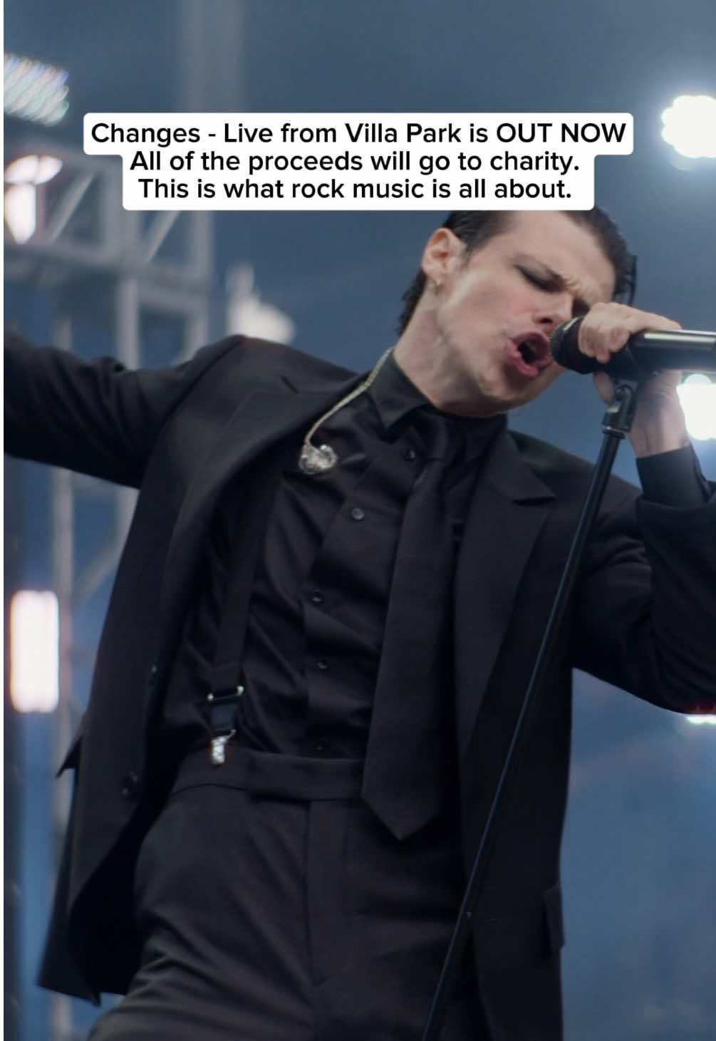 A post by @yungblud on TikTok caption: Changes - Live From Villa Park (Back To The Beginning) is OUT NOW on all streaming services and YouTube. Every penny earned will go to acorns, Cure Parkinson’s and Birmingham children’s hospital so go stream it, add it to your playlist or watch the video. Every time you do we will raise some money. 🖤🦇🖤