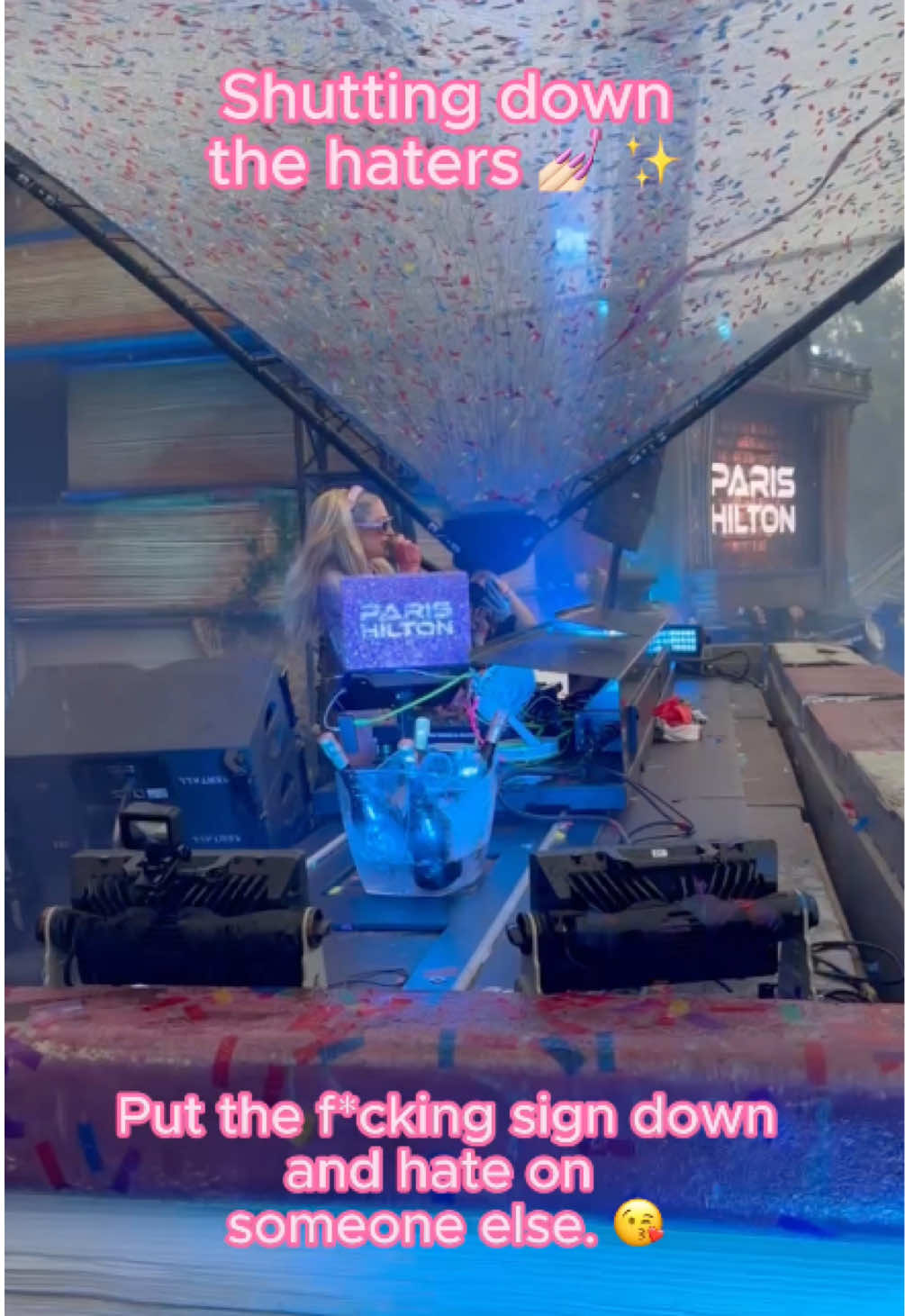 A post by @parishilton on TikTok caption: Go hate on someone else 💅🏻 #Throwback to this iconic #Tomorrowland moment 🎧 So sad to be missing it this year, but I’m so happy that everyone is safe! 💖 Go dance your hearts out ✨@Tomorrowland 