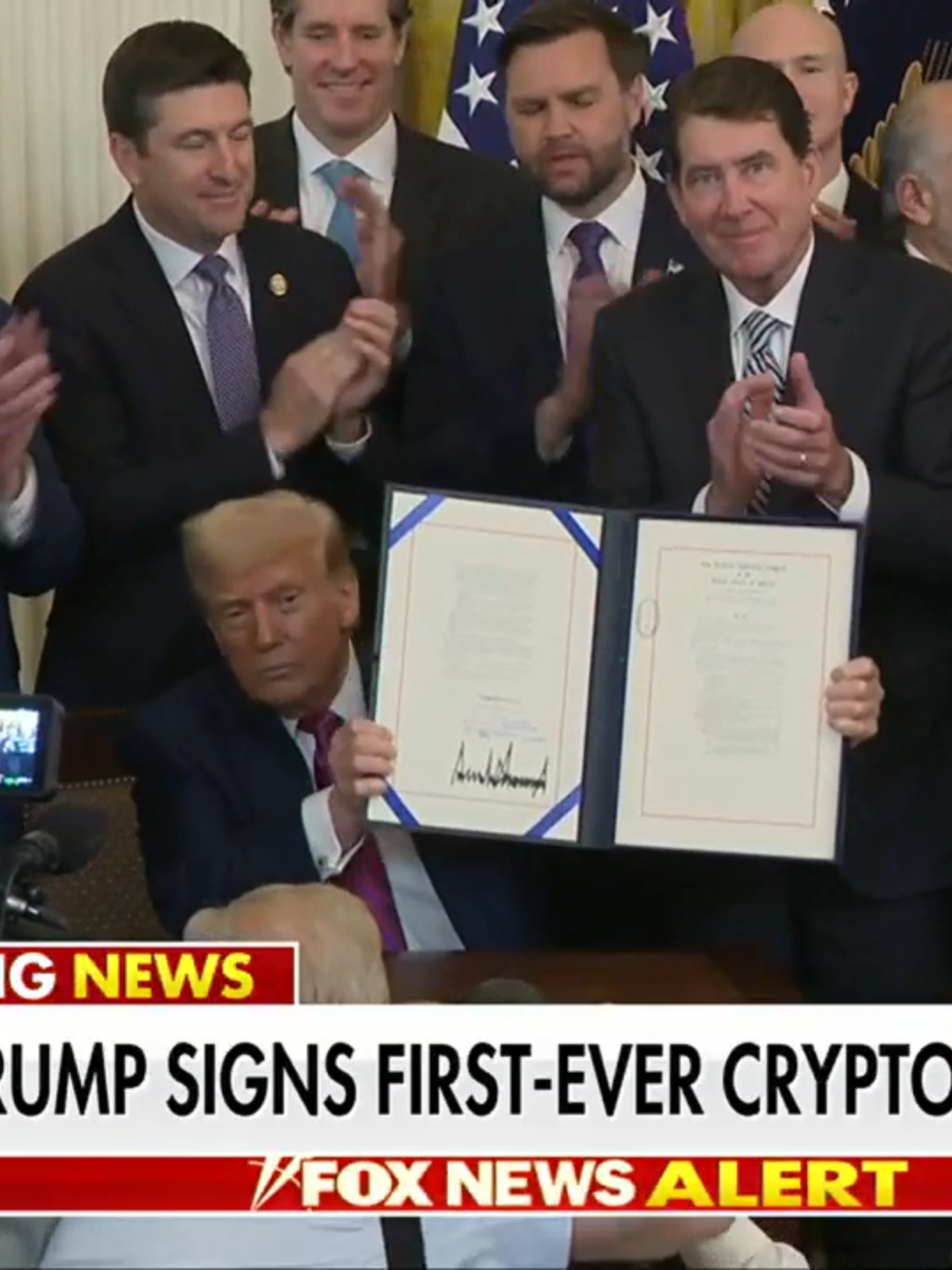 A post by @foxnews on TikTok caption: BREAKING: President Trump signs first major federal crypto bill into law: "This is not an autopen, by the way."