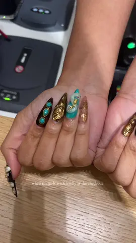 A post by @teamdela on TikTok caption: Not her doing her own press ons 🥵 #girlsgirls #whileshopping 