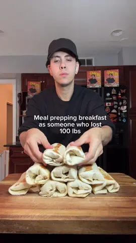 A post by @benjixavier on TikTok caption: BREAKFAST BURRITOS 💥🌯 High-protein, meal-prep friendly, and freezer-approved! These burritos are the real MVP. They’re cheesy, hearty, and packed with flavor (and 23g of protein each 😮‍💨). Perfect for those busy mornings when you need fuel fast. Makes: 10 burritos Macros (per burrito): 🔥 320 Calories 💪 23g Protein 🥑 7g Fat 🍞 33g Carbs 🛒 Ingredients: Veggie & Meat Base: 🫑 2 bell peppers, diced 🧅 1/2 medium white onion, diced 🥔 1 lb yellow potatoes, diced 🥩 1/2 lb 95% lean ground beef 🧂 1 tsp salt 🌶️ 1 tsp black pepper 🌮 1/2 packet taco seasoning 🧀 1/2 cup reduced-fat taco blend cheese 🌯 10 reduced-calorie burrito wraps 🫧 Olive oil cooking spray Egg Mixture: 🥚 2 3/4 cups egg whites (I used Egg Beaters) 🧀 1 cup low-fat cottage cheese, blended 👩‍🍳 Instructions: 	1.	Chop your veggies and spread them on a lined baking sheet. Roast at 400°F for 40–50 min, stirring halfway through. 	2.	Blend egg whites + cottage cheese until smooth and creamy. That’s your high-protein egg base. 	3.	Once veggies are roasted, remove from oven, add the ground beef right on top, and return to oven for ~10 min until browned. 	4.	Pour egg mixture over everything, sprinkle cheese on top, and bake at 375°F for 20–25 min until set. 	5.	Let it cool for 10 min before slicing into 10 portions. 	6.	Roll up each slice in your burrito wrap 🌯 	7.	Toast each burrito in a skillet until golden and sealed — no exploding burritos in the microwave later! 	8.	Store in the fridge (up to 4 days) or freezer (for long-term prep). 	9.	Reheat & devour 😮‍💨 Meal prep gold. Freezer heroes. Tag a friend who needs these in their life 👇