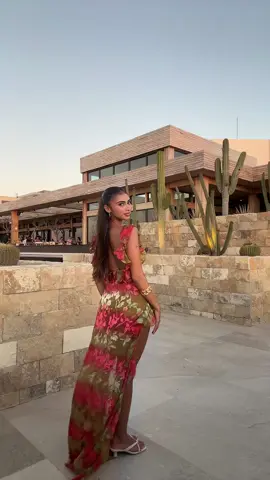 A post by @bellarmrz on TikTok caption: the right time to use this audio 😅 #sunsetdress dress from @IntoGaia 