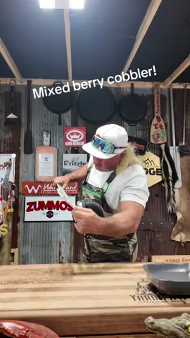 A post by @stalekracker on TikTok caption: Come along as we whip up a wild blackberry and raspberry cobbler that'll make your grandma jealous. Fresh berries, hot crust, and pure Southern flavor—just how we like it. #CobblerRecipe #StalekrackerKitchen #SouthernCooking #BerrySeason #CastIronCooking #BackyardEats #FoodWithFlavor 