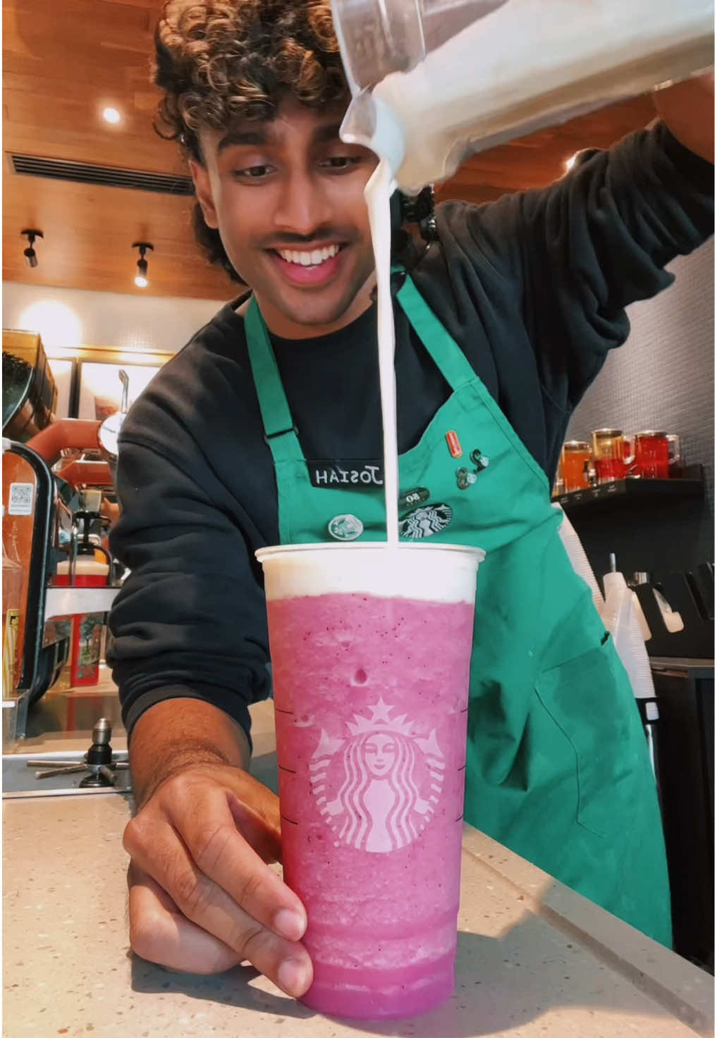 A post by @itsjoboi on TikTok caption: The Barbie Drink is absolutely DELICIOUS at Starbucks!😮‍💨 #fyp #viral #trend #starbucks #indian #barista #brown 