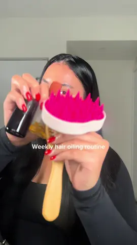 A post by @ on TikTok caption: Hair oiling day 🫶🏽✨ #hairtok #healthyhair #longhair #shinyhair #hairoil #hairoiling #hairgrowth #haircare #hairgrowthoil 