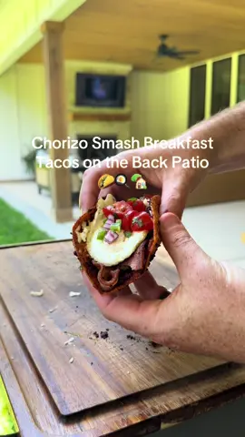 A post by @tylergrowthlife on TikTok caption: Chorizo smash breakfast tacos on the back patio #vlog #cookingvlog #DayInTheLife #blackstone #lifestylevlog #backpatio #backyardvibes 