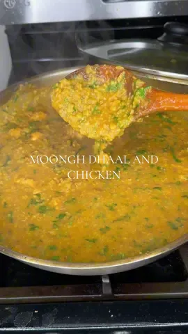 A post by @sharmineats on TikTok caption: Moong Dhaal and chicken curry 🍛  Recipe: 4-5 tbsp ghee  2 1/2 tbsp GG paste  1.5lbs Chicken breast  1 tbsp salt  5-6 green chilies 1 large onion  1 tbsp cumin  2 tbsp curry powder  2 tbsp red chili powder  2 tsp turmeric  2.5 cups soaked moong dhaal  10 cups water 1 cup cilantro  #bengalifood #bangladesh #dhaalrecipe #moonghdhaal #sylheti #recipesforyoupage  