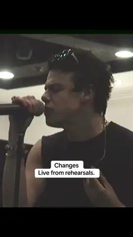 A post by @yungblud on TikTok caption: Live from Rehearsals. The day before the show we all got together in the dressing room of Villa Park ran it through a couple times and we were ready to gig it. An honour to play with the best to do it.  Please go buy it on iTunes. It’s only £1/$1 and all the money will go straight to the charities. Stream it, add it to your playlist or watch the video. Let’s raise some money 🖤🦇🖤