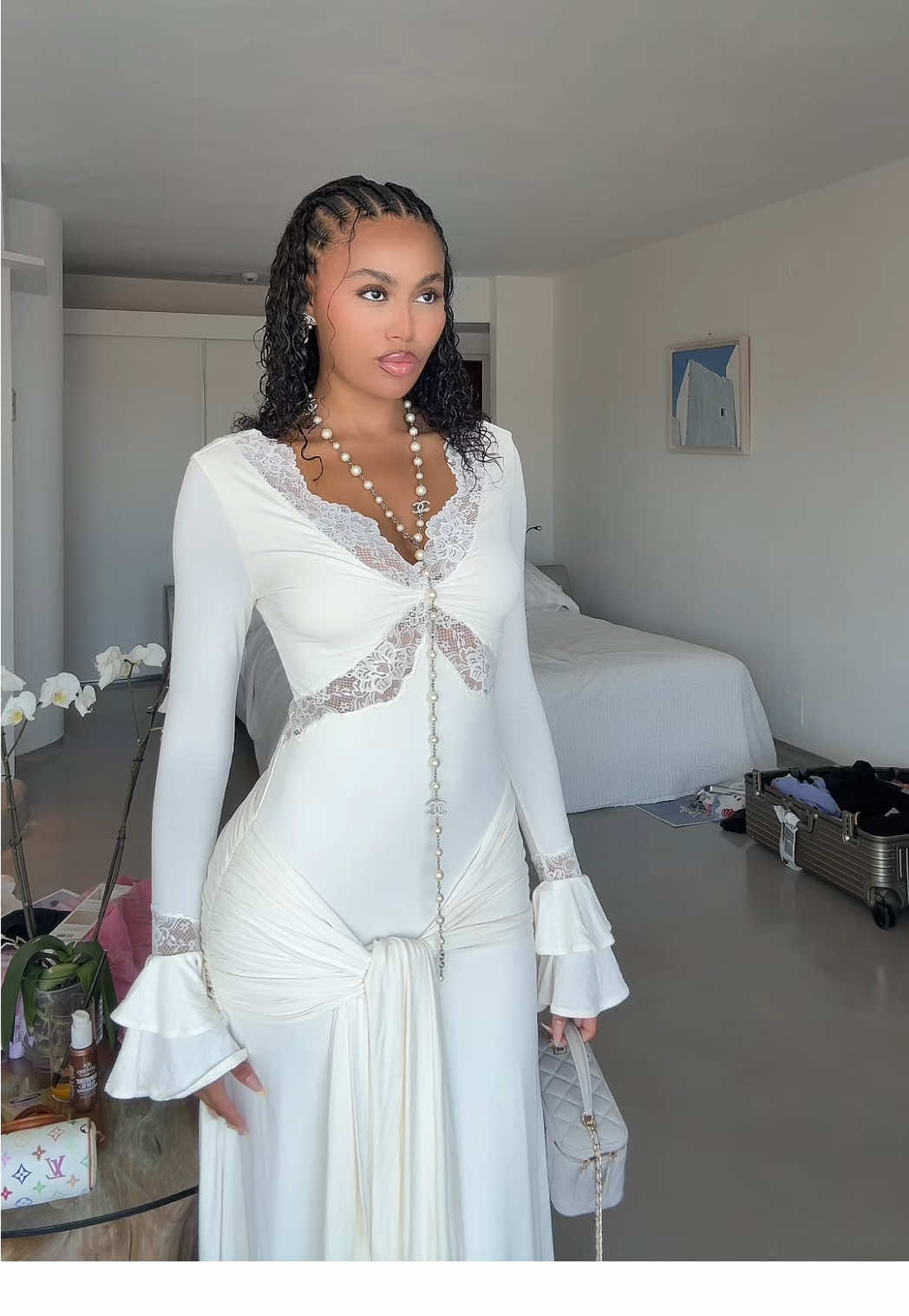 A post by @3llathomas on TikTok caption: when the dress has you feeling like an angel 🪽🤍 @Meshki 