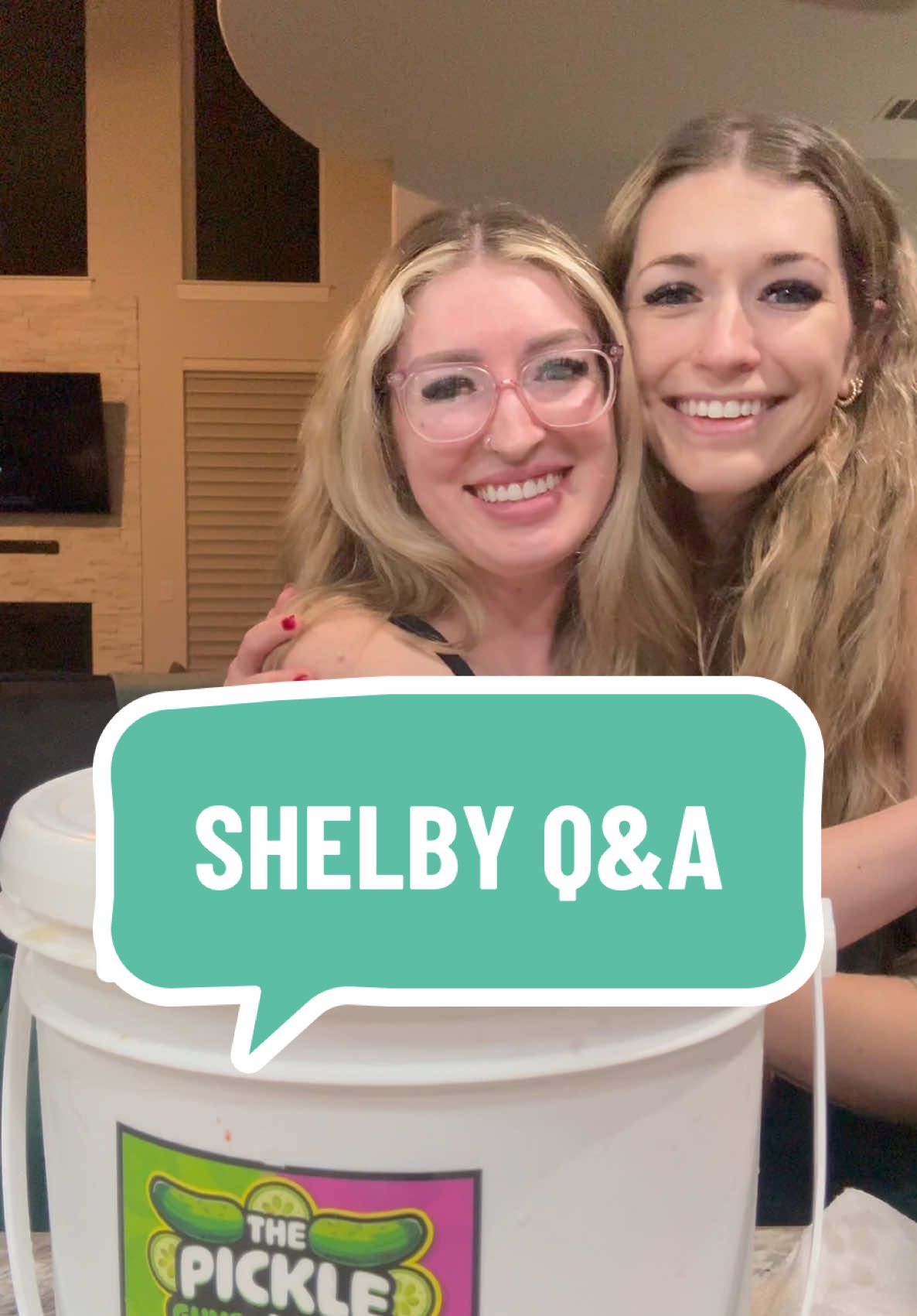 A post by @cookiterica on TikTok caption: Replying to @AgentChristy @shelbylance ⭐️QUESTIONS AND ANSWERS⭐️ IS SHELBY MORGAN’S  LONG LOST SISTER????? (Shelby is @solsticebeautyatx sister 💚💖) Also here’s some behind the scenes of Shelby’s husband trying our pickles. #questionsandanswers #foodreview #picklereview #pickles #pickle 