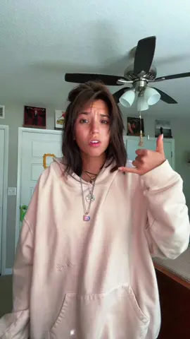 A post by @valeklinar on TikTok caption: Heading out on the town if that’s okay w everyone 🙂‍↕️ #justagirl  #thrifted #shorthair #bangs #jewelry 
