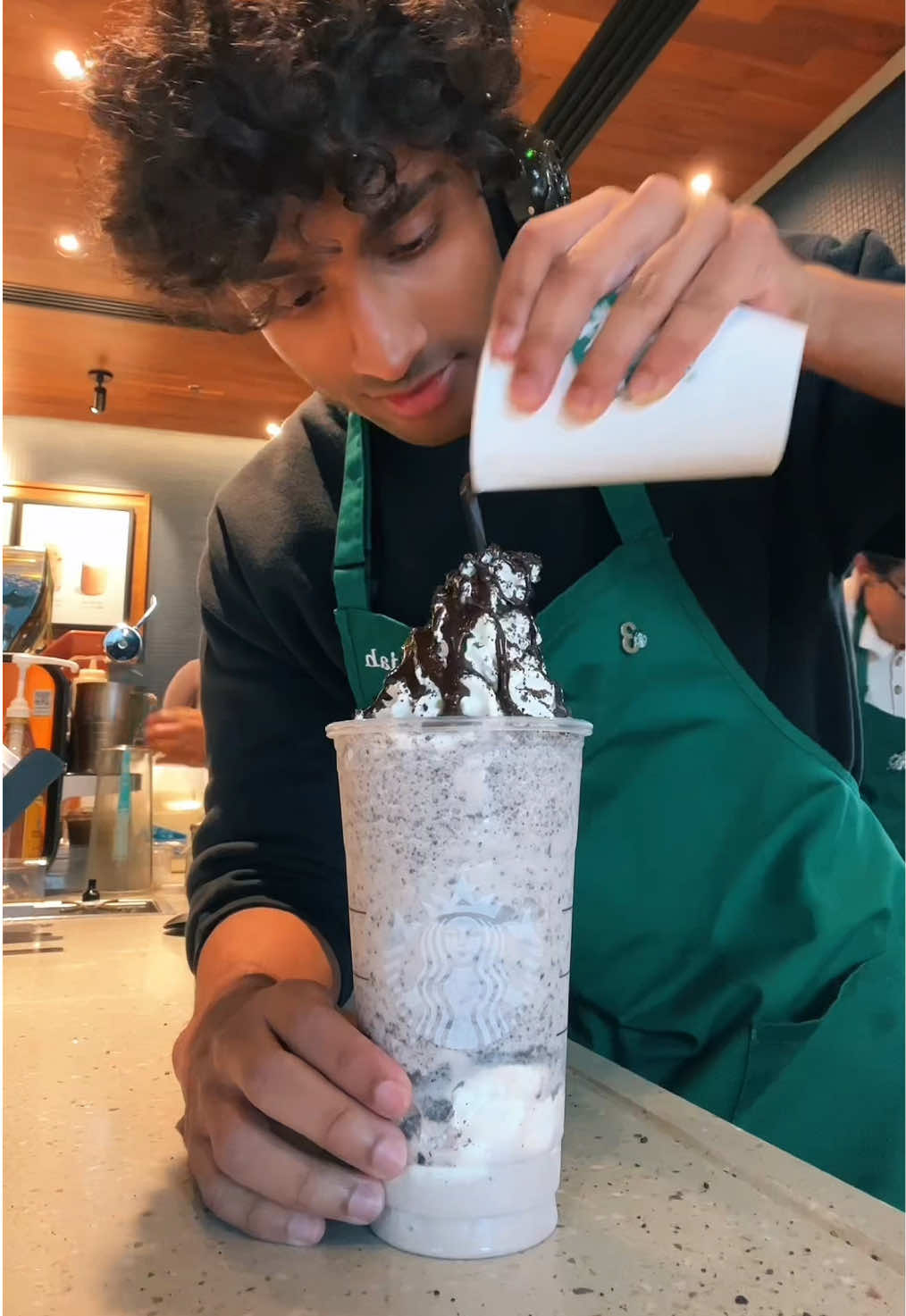 A post by @itsjoboi on TikTok caption: Oreo Cookie Frappuccino is a DELICIOUS drink at Starbucks!🔥 #fyp #viral #trend #starbucks #indian #barista #brown 