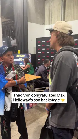 A post by @espnmma on TikTok caption: Theo Von makes sure to congratulate the Holloway’s on his way out of #UFC318 #theovon #maxholloway #UFC 