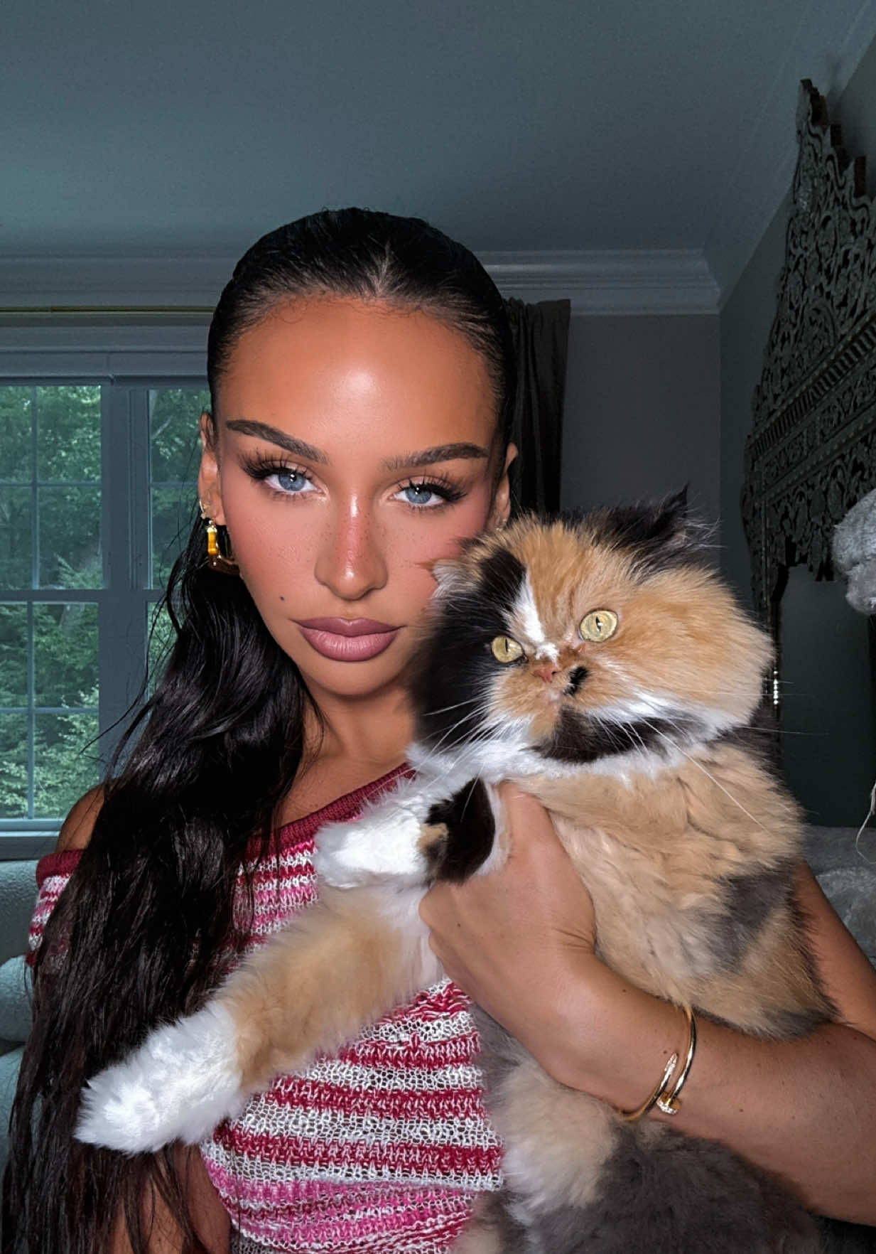 A post by @carlibybel on TikTok caption: my first born Cindy🥹🤎🐱 ps she’s only annoying bc she wakes me up EVERY night kneading on me AND she drools on my face.. sorry Cinna  #cats #catmom 