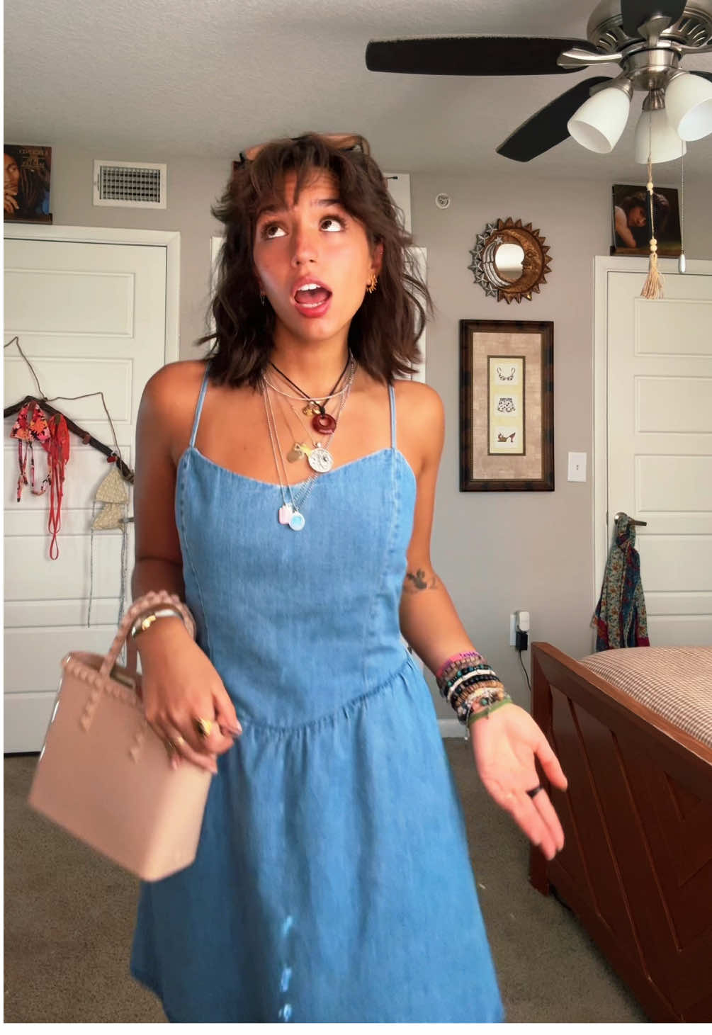 A post by @valeklinar on TikTok caption: Once again I’n begging someone to make music like this again 🧍‍♀️#justagirl  #thrifted #shorthair #bangs #jewelry 