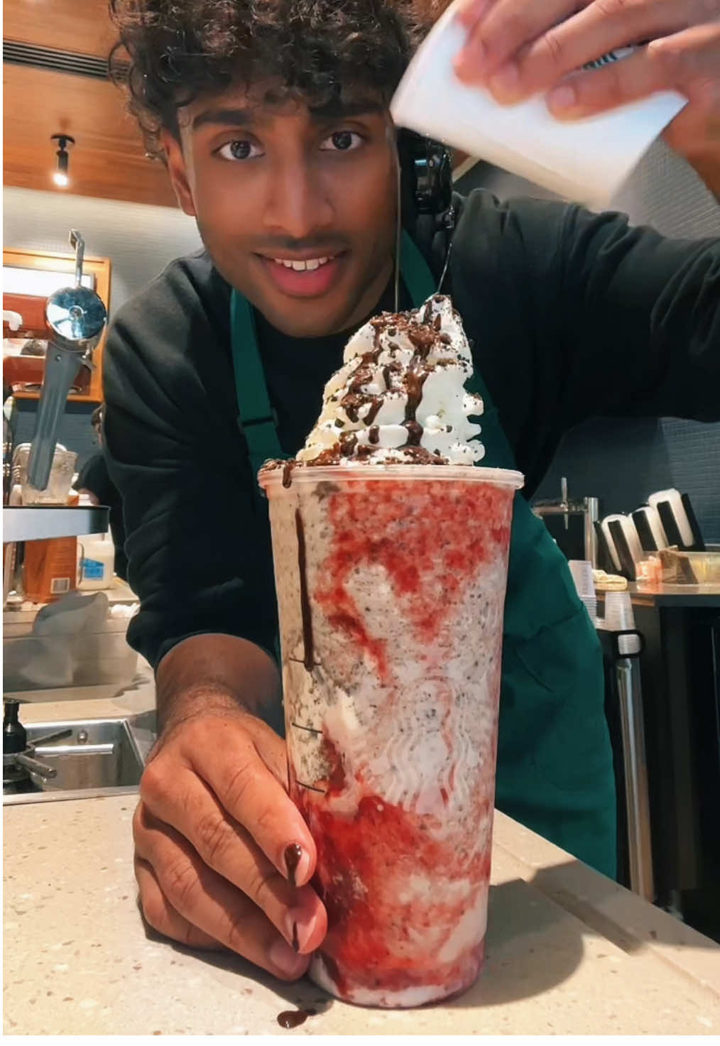 A post by @itsjoboi on TikTok caption: The Itachi Drink awakens my Sharingan🔥 #fyp #viral #trend #starbucks #indian #barista #brown 