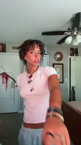 A post by @valeklinar on TikTok caption: If you’re not at least a tadddd weird then life is just BORINGGGGG #justagirl  #thrifted #shorthair #bangs #jewelry 