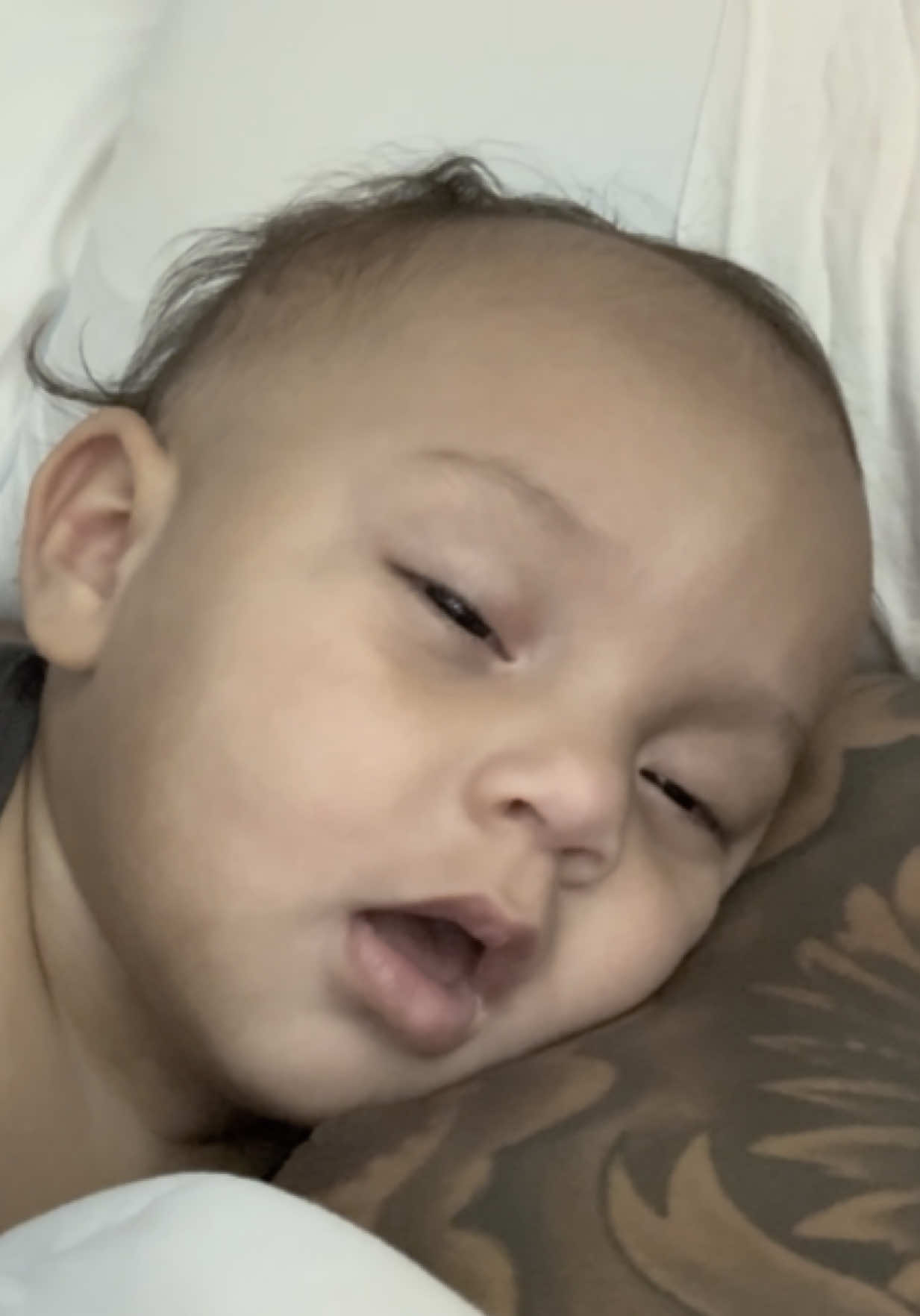 A post by @larobenz on TikTok caption: Nah at one point he looking at the camera 😂 @Zaza #funny #viral #babies 