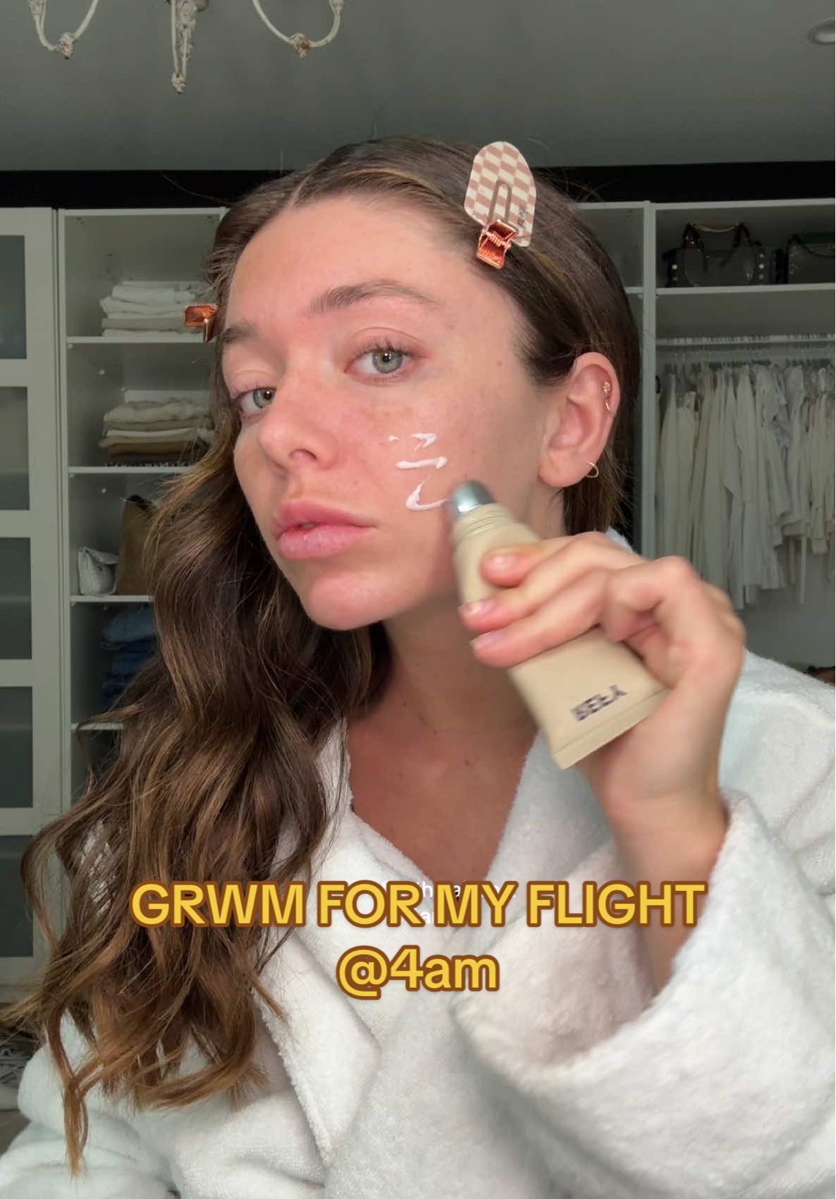 A post by @tabithaswatosh on TikTok caption: my airport makeup routine 😙 forever waking up early to get ready for my flight :))))) #grwm 