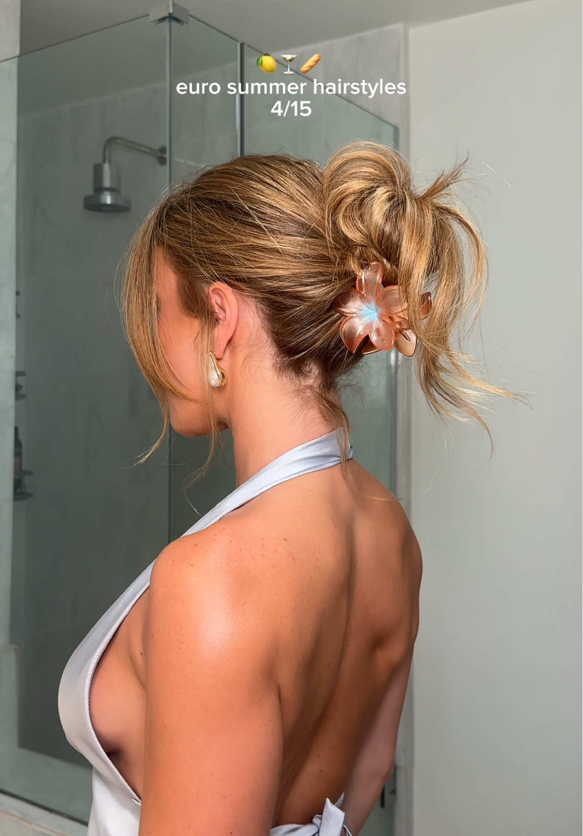 A post by @anggwells on TikTok caption: Calling this the 3 second claw clip messy bun 
