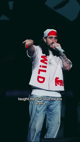 A post by @russ on TikTok caption: performing this with a flower thrown by a fan…fitting ❤️