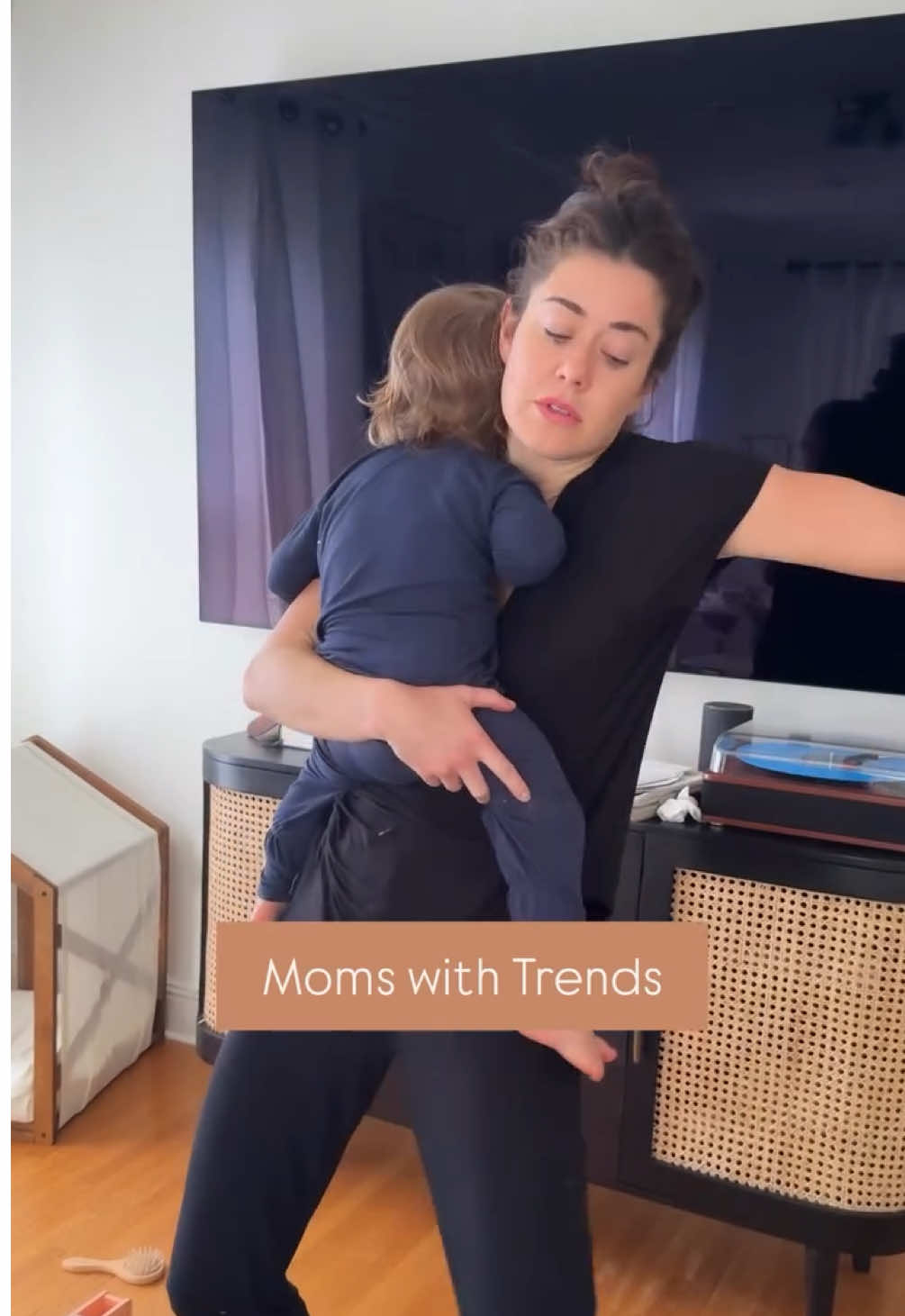 A post by @manonmathews on TikTok caption: POV: You’ve been holding a feverish baby for 72 hours straight but you’re still trying to hit the trending sound because… mama may be sleep-deprived, but she’s still got it 💁‍♀️🍼🔥 #mama #motherhood #trends 